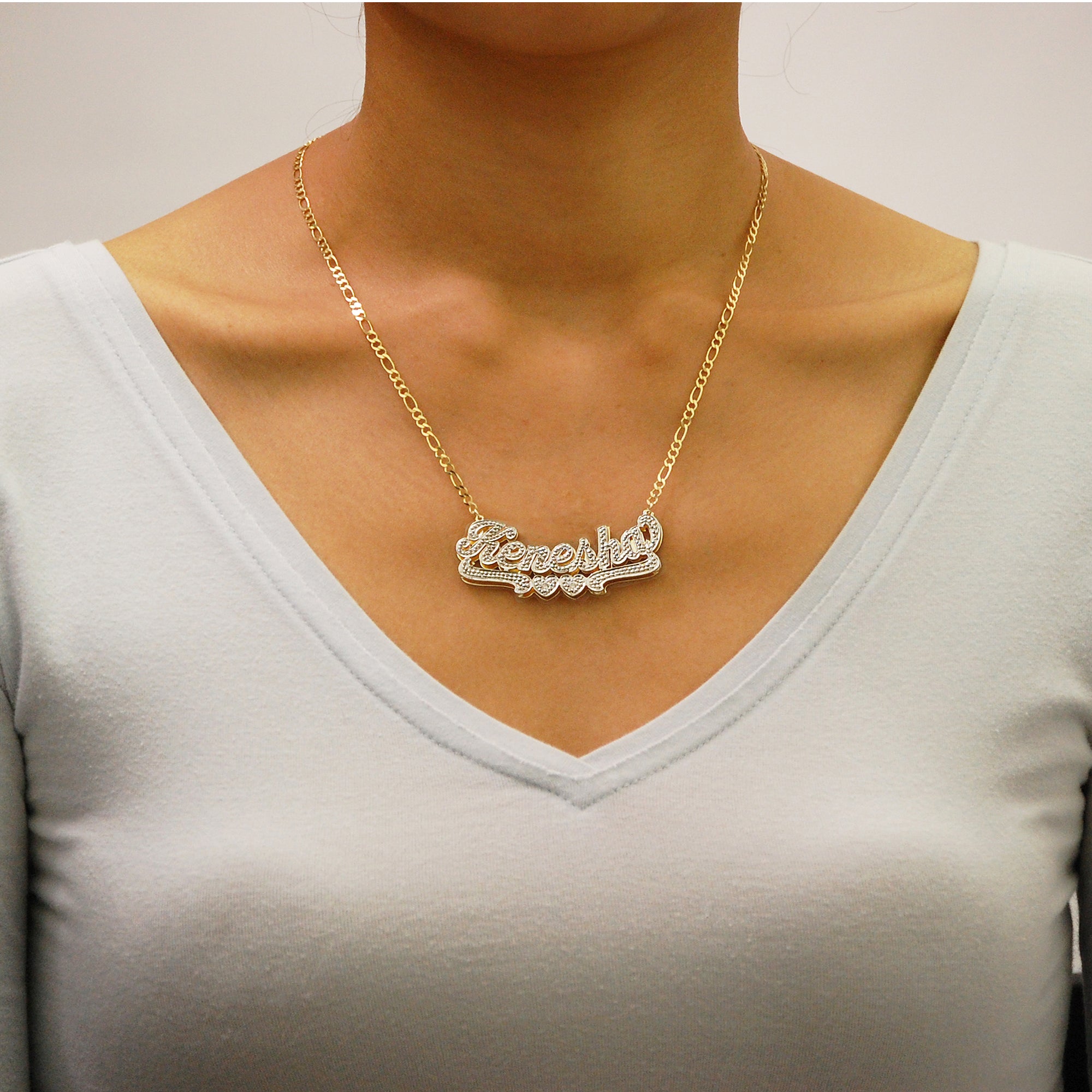 Woman wearing custom solid gold 3D double plate nameplate necklace