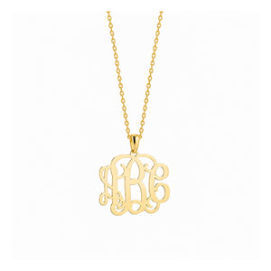 Size view showing 0.6-inch dimensions of the extra small 10k solid gold monogram pendant.