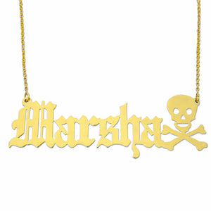 Close-up of 10k yellow gold Old English personalized name pendant with custom skull end piece.