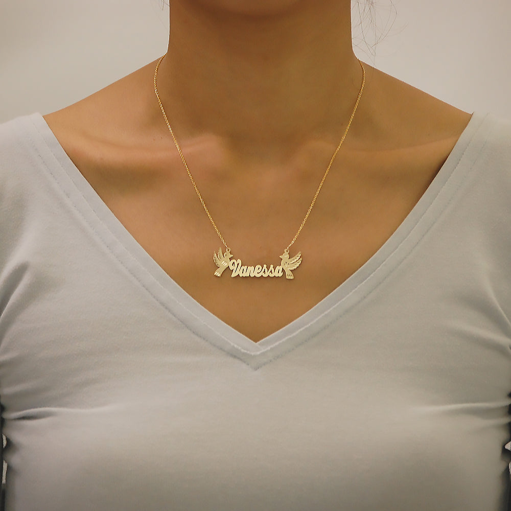 Model wearing custom 14k gold bird nameplate necklace on an 18-inch chain.