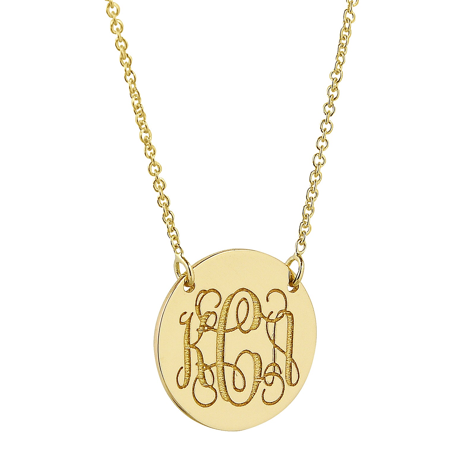 Close-up of a 1/2 inch solid gold monogram disc pendant featuring a Rolo chain.