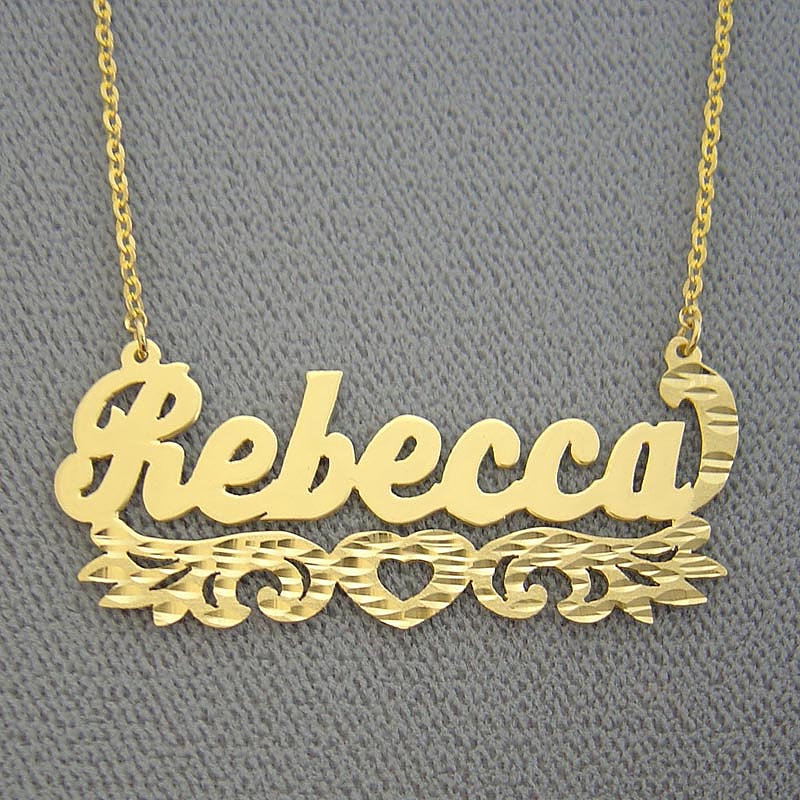 14k solid yellow gold personalized name necklace spelling "Rebecca" in a diamond-cut script font with a heart underline flourish.