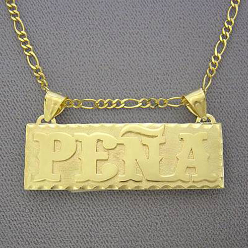 Close-up of custom 14k gold rectangular nameplate showing the 0.7mm raised lettering and 0.5mm base plate thickness.