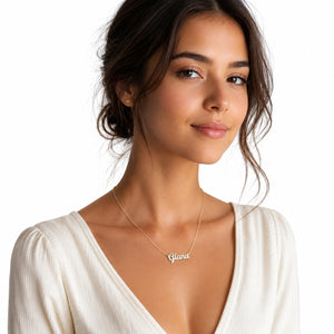 Model wearing 14k solid gold dainty script name necklace on an 16-inch chain