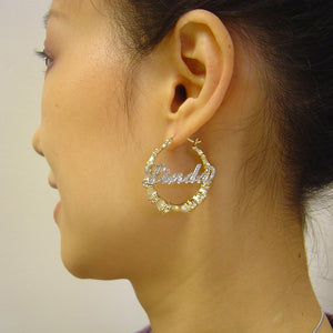 Side view model wearing 1.7 inch custom gold iced out bamboo nameplate hoop earrings