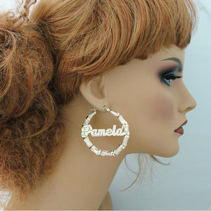 Mannequin wearing 2 inch 10K gold personalized bamboo hoop earring