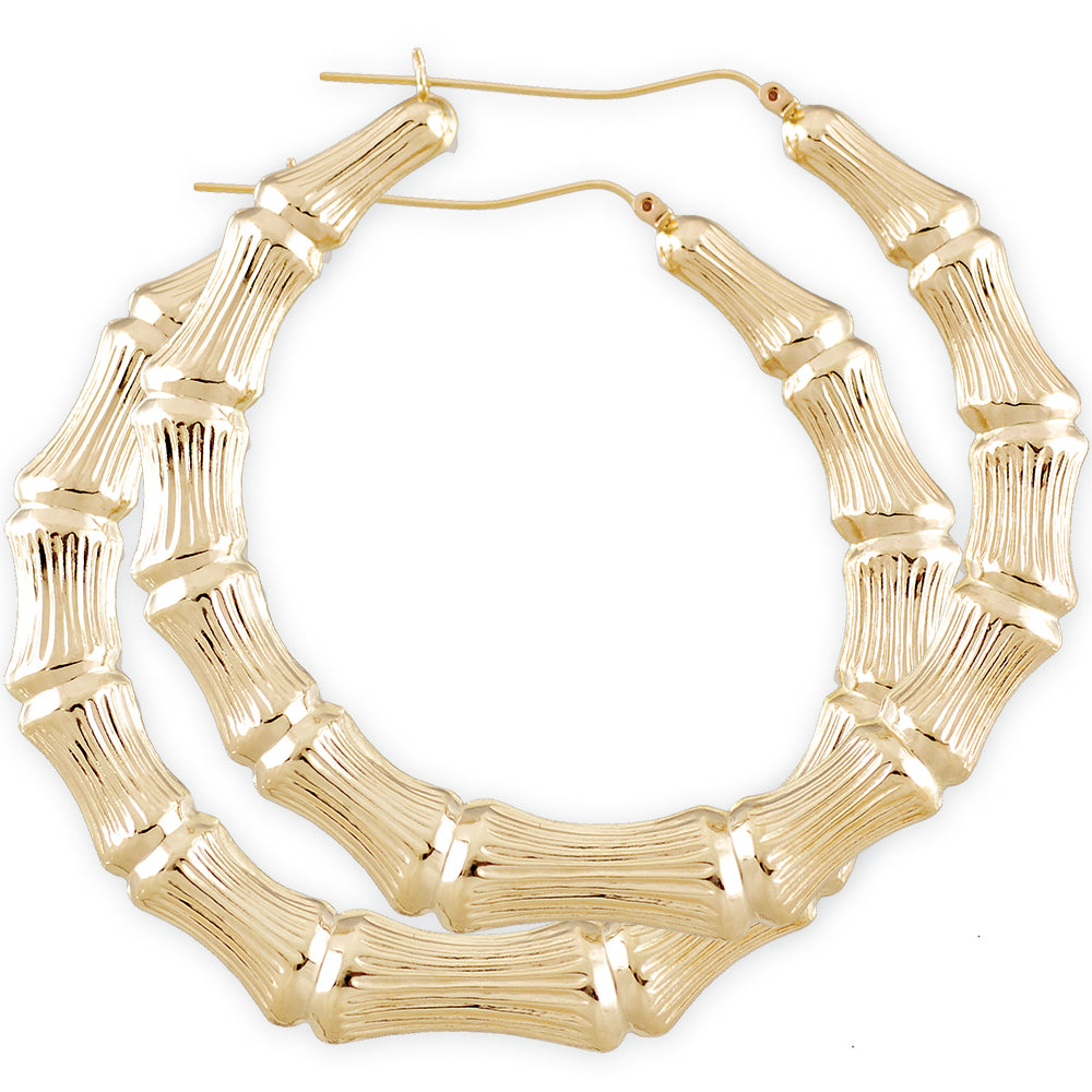 A pair of large 10K gold hollow round door knocker bamboo hoop earrings with a 3-inch diameter.