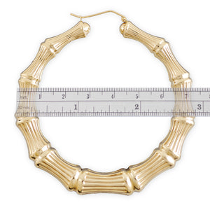 Close-up of clip closure on 14k gold hollow bamboo hoop earring