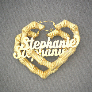 Pair of personalized 10k yellow gold heart-shaped bamboo hoop earrings with custom cursive nameplate