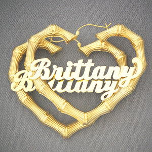 Personalized 10k or 14k gold heart-shaped skinny bamboo hoop earrings featuring custom cursive name script.