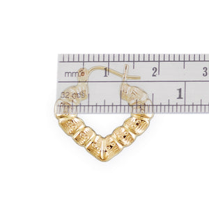Close-up of 10K gold puffy heart bamboo earring showing texture and clip closure