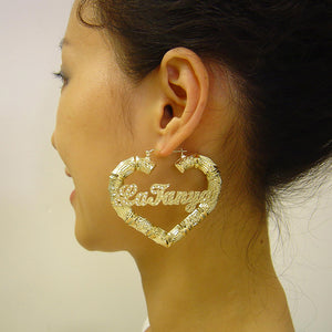 Woman wearing large 2.5 inch 10K gold personalized heart bamboo hoop earring
