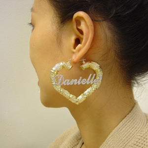 Side view of 2.5 inch custom 10K yellow gold heart bamboo hoop earring with snap closure