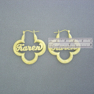 Side view detail of 10K real gold flower bamboo name earring with hinged hoop closure