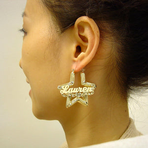 Close up of 10K gold personalized cursive script nameplate on bamboo hoop earring
