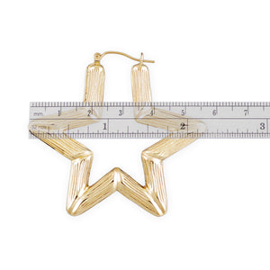 Close-up view of 10K yellow gold star bamboo hoop earring showing snap closure