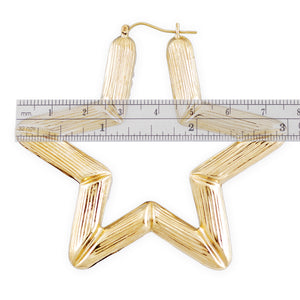 Close-up of puffed hollow 10K yellow gold star bamboo earring design