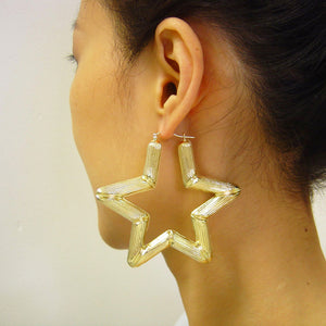 3-inch 10K yellow gold star bamboo door knocker earrings shown for size reference