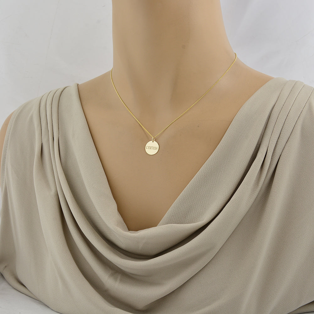 Solid gold personalized name disc charm pendant with a model