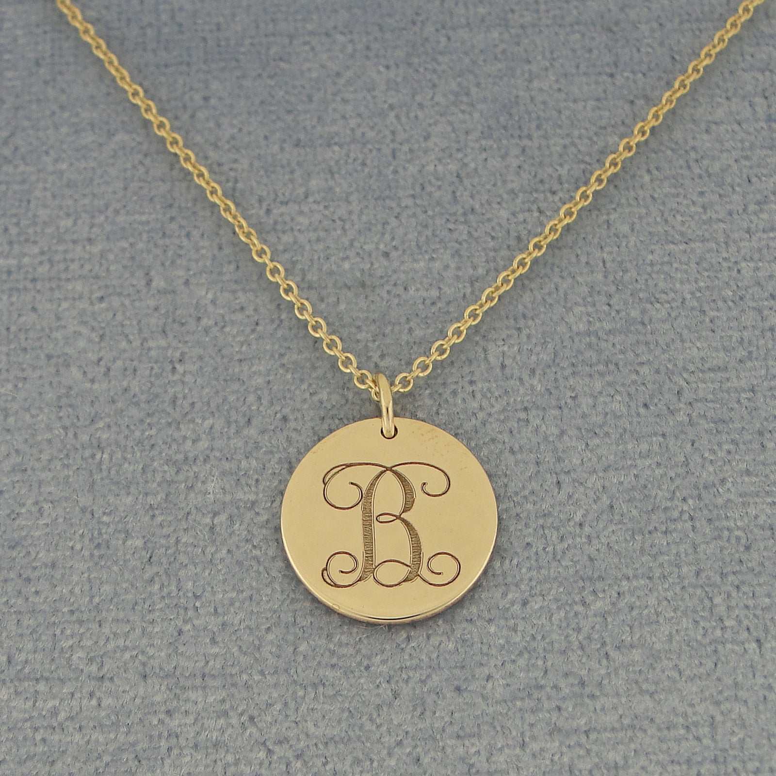 Solid yellow gold monogram initial disc charm pendant with a deep laser engraving