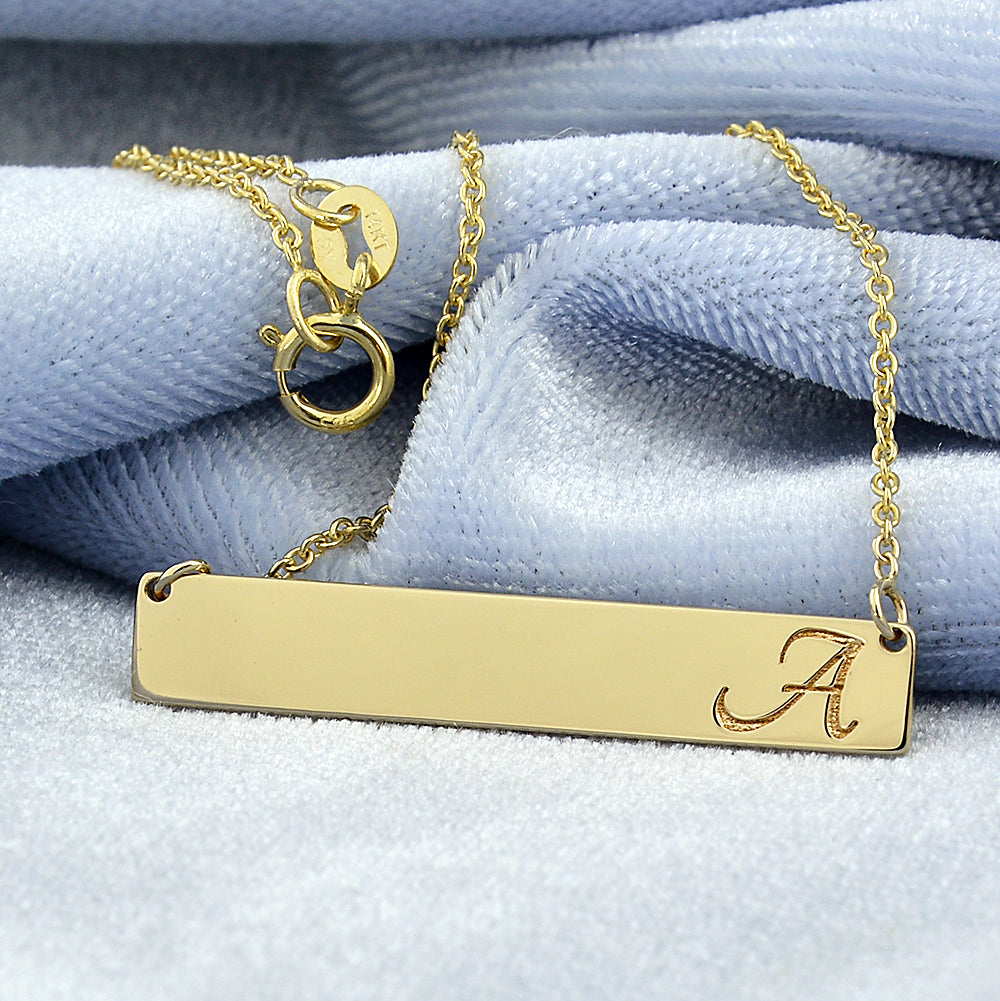 Personalized 14k yellow gold horizontal bar necklace with custom laser-engraved name
