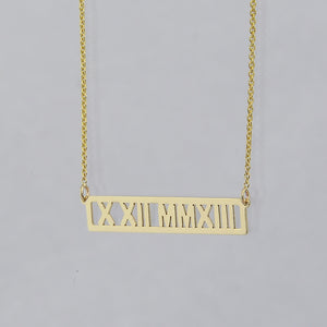 Solid 14k yellow gold horizontal bar necklace with custom Roman numeral date engraving