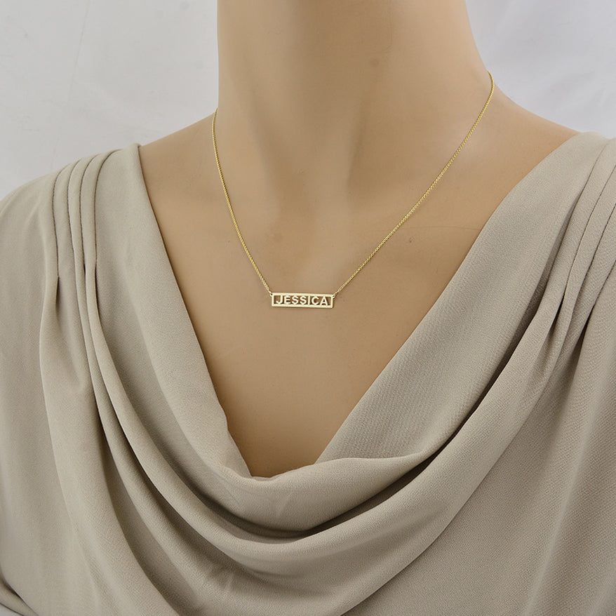 mannequin wearing dainty solid gold JESSICA bar necklace