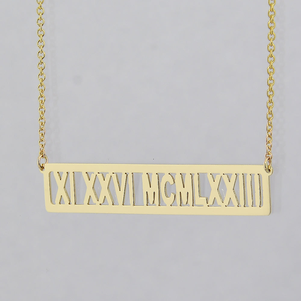 Custom 14k yellow gold horizontal bar necklace engraved with Roman numeral date XI XXVI MCMLXXIII