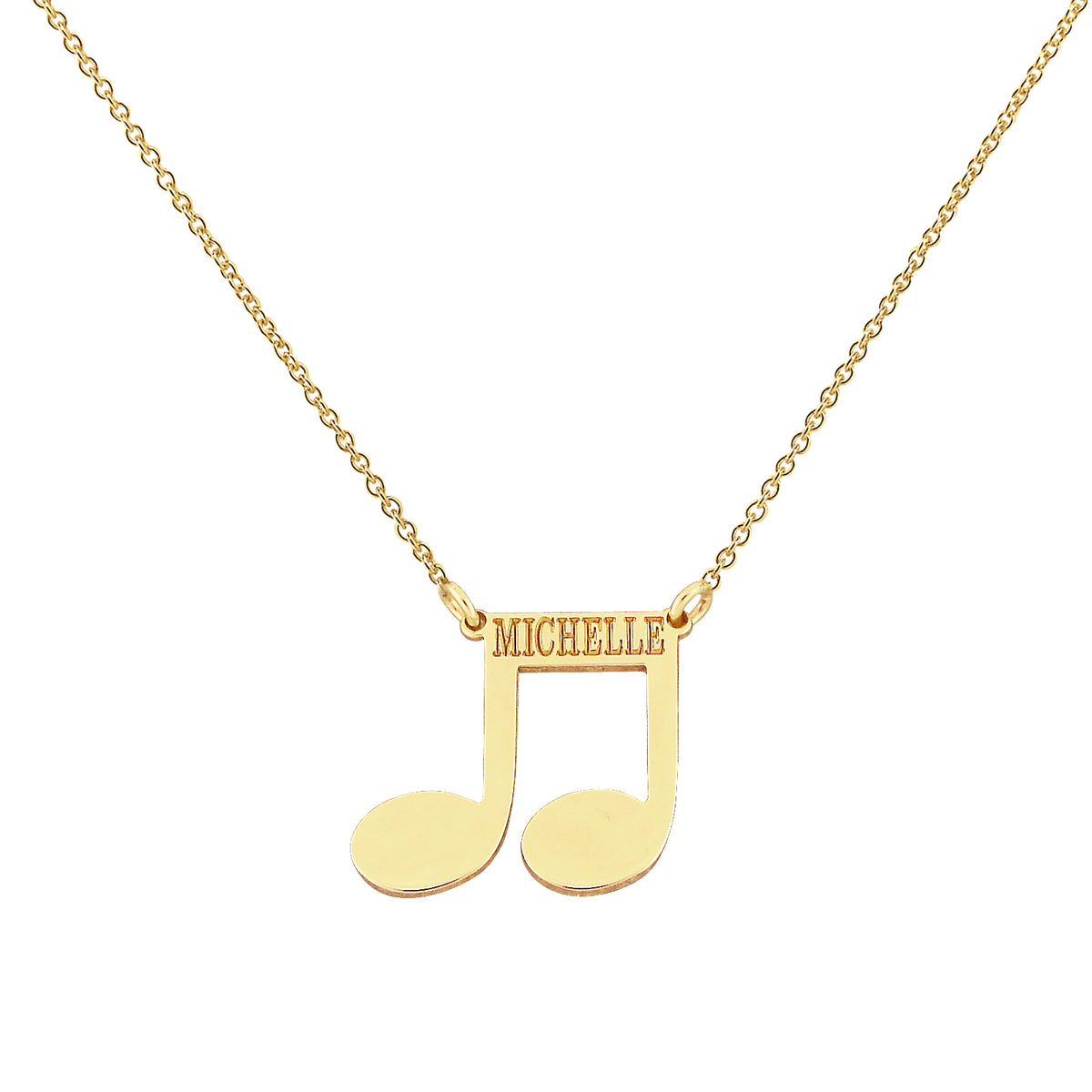 Custom solid 14k gold music note name necklace engraved with the name Michelle