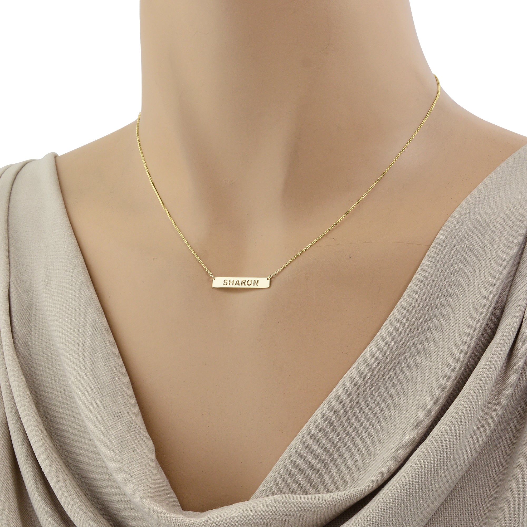 Model wearing an extra small personalized solid gold horizontal bar necklace handcrafted by Soul Jewelry