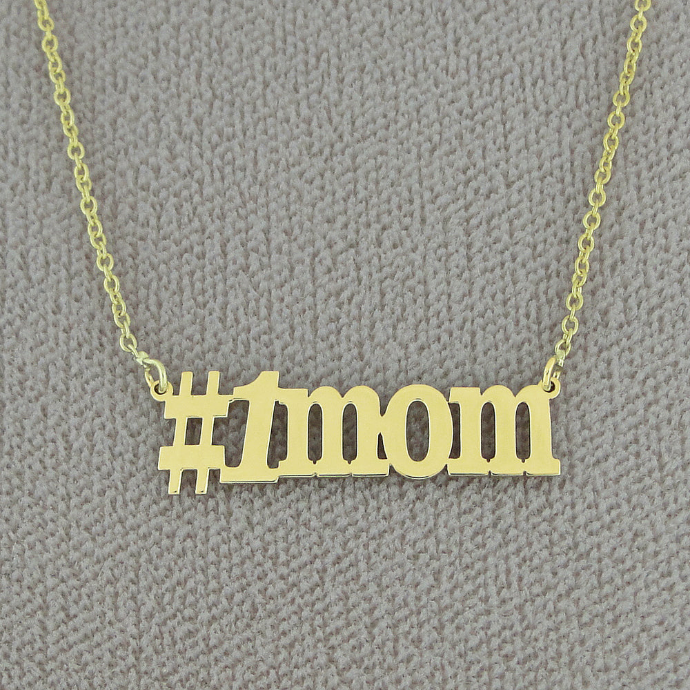 Solid yellow gold #1 Mom charm necklace displayed on a chain with cut-out