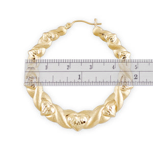 Hinged snap-bar closure on 10K gold door knocker hoop earrings