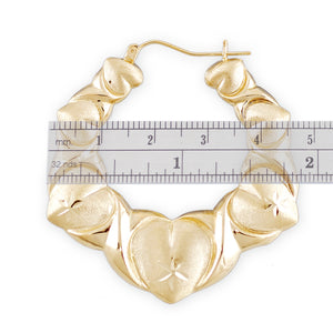 Side view of 10K gold diamond cut puffy XO heart earring showing hinged snap closure