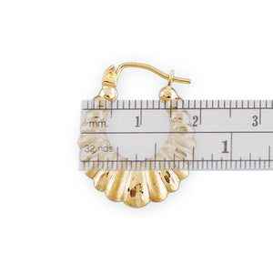 Hinged snap closure on 10k gold hollow shrimp hoop earrings
