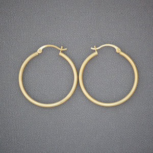Pair of 14K yellow gold 2mm classic hollow hoop earrings with high polish finish, 30mm diameter