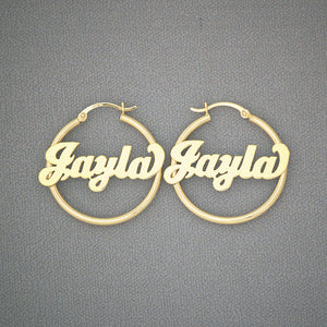 Custom 14K solid yellow gold 2mm tube name hoop earrings in bold cursive lettering, 30mm diameter