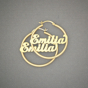 Pair of 14k yellow gold personalized name hoop earrings 35mm with shiny cursive lettering