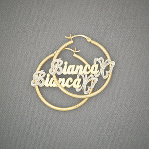 Custom 14k gold name hoop earring with iced-out cursive nameplate and butterfly detail
