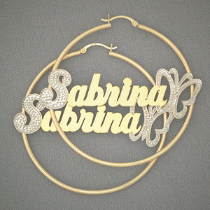 Detailed view of 14K two-tone iced-out cursive nameplate with butterfly accent
