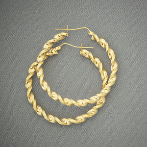 Pair of 10K yellow gold 4mm twisted hoop earrings with hinged snap closure on white background