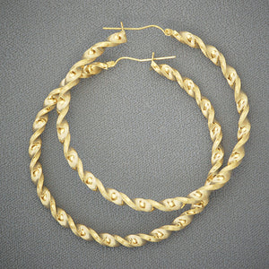 10K yellow gold 4mm twisted round hoop earrings with secure hinged snap closure on white background