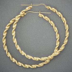 10K yellow gold 4mm twisted round hoop earrings 3 inch diameter on white background