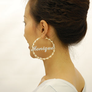 Model wearing 3 inch large 10K gold two tone iced out custom name hoop earrings