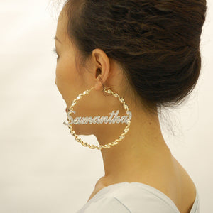 Model wearing extra large 3.5 inch 10K gold custom personalized name hoop earrings