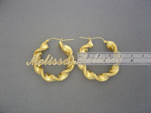 Pair of 10K gold 8mm twisted round hoop earrings with secure hinged snap lock closure