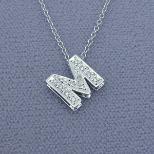 Side view of 3D double plate diamond initial pendant showing double-layer thickness and hidden chain bail