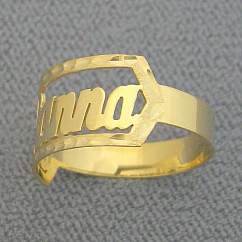 Handcrafted cursive name ring in solid gold showing high-polish finish