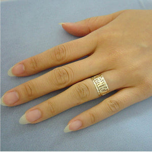 Custom solid gold Western style name ring customized with MONICA worn on ring finger