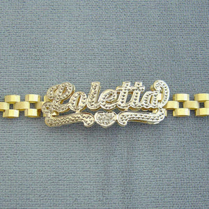 Detail of hand-engraved 3D iced out nameplate on 10K gold presidential link band