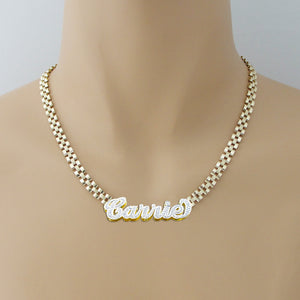 Model wearing personalized 10K gold iced-out nameplate necklace on 6mm watch band chain